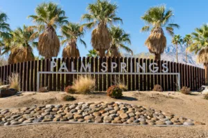 brown wooden fence with brown sand from Palm Springs Things to Do